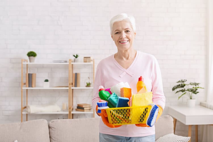 Senior woman getting ready for spring cleaning.