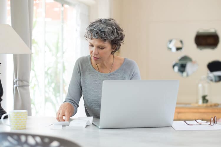 Senior woman planning for senior living financing.
