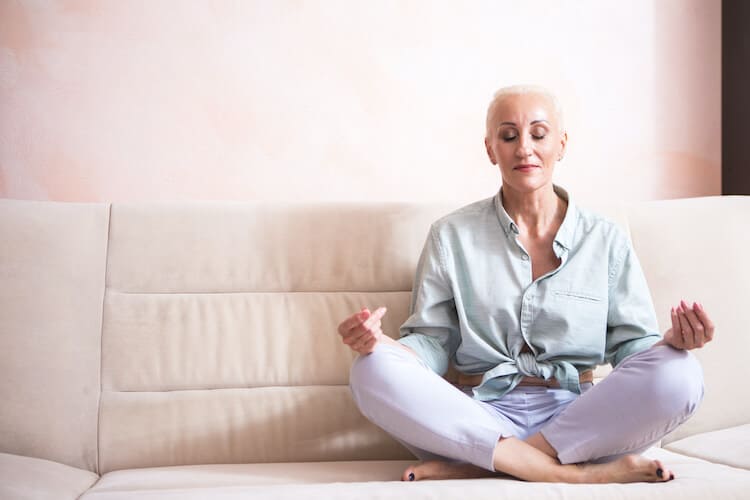 Senior woman practicing yoga.